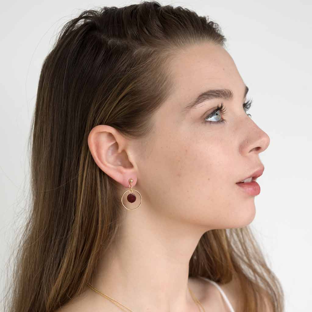 Model wearing Halo Sunrise earrings Gold and Red Agate