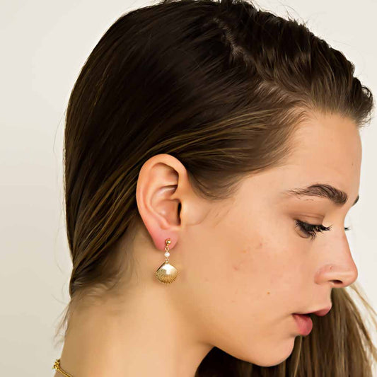 Model wearing Impressions Golden Shell Earrings - Gold and Pearl