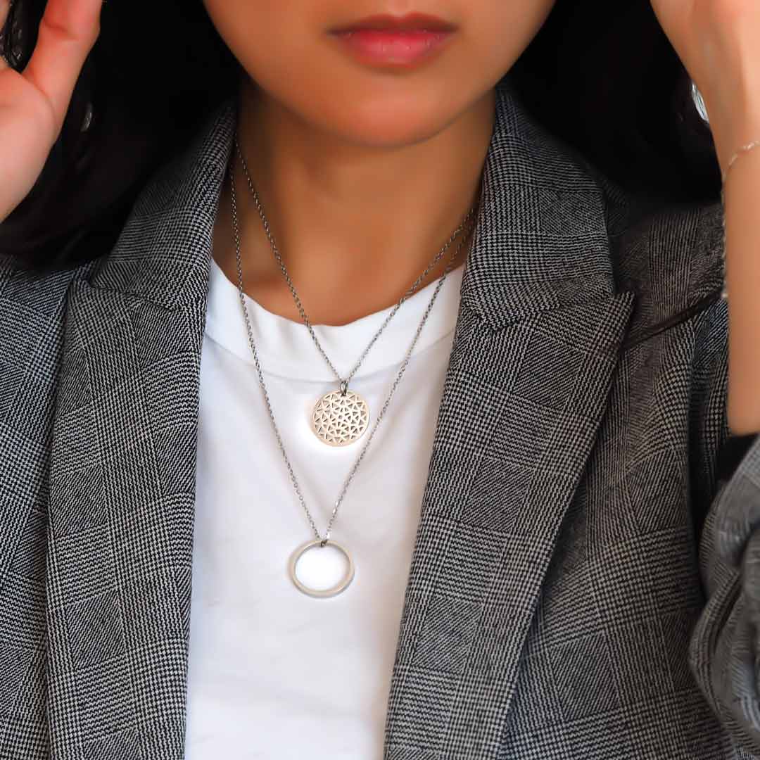Model wearing Dandelion and ROF single pendants rhodium
