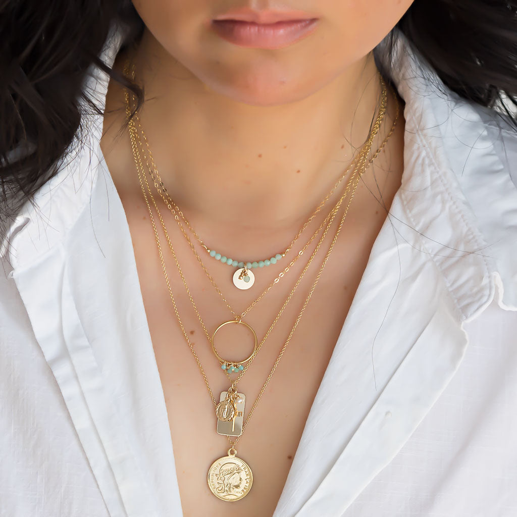Model wearing Aura and Halo Amazonite Reflections and Coin Gold