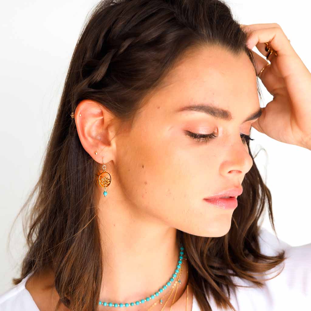 Model wearing Baby Lotus Earrings Gold and Amazonite
