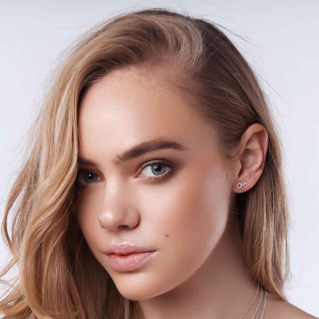Model wearing Colliding Suns Earrings side
