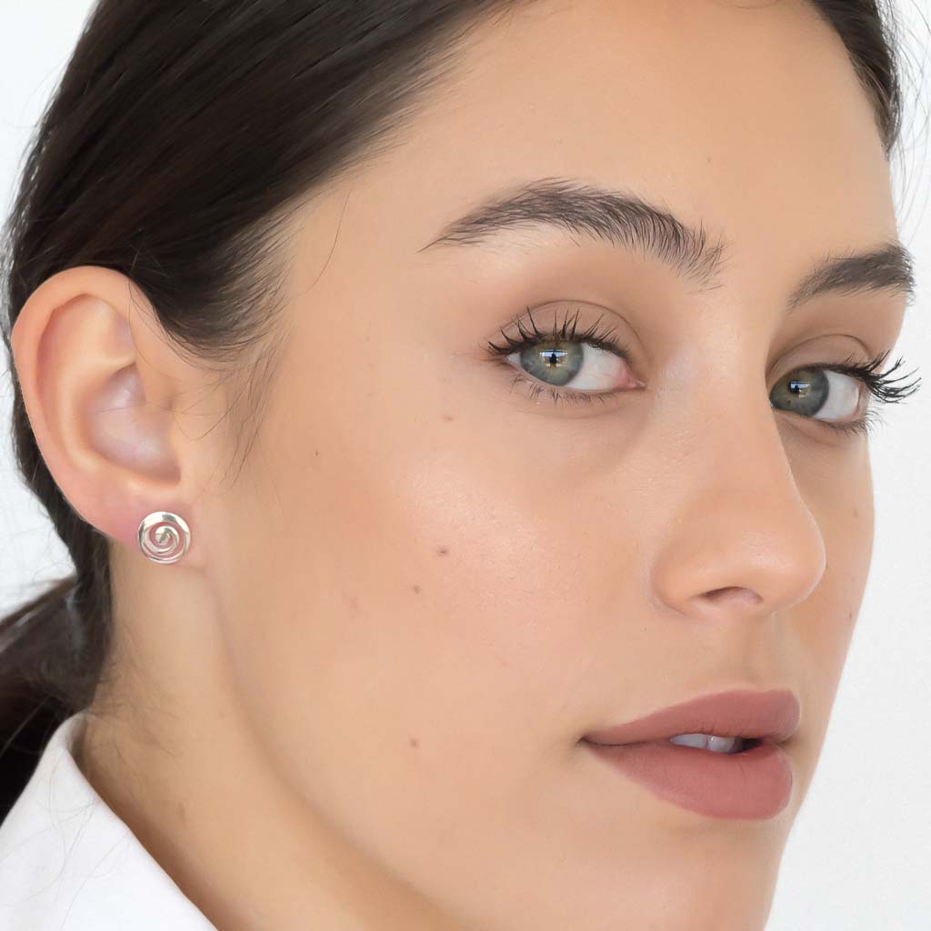 Model wearing Current earrings sterling silver