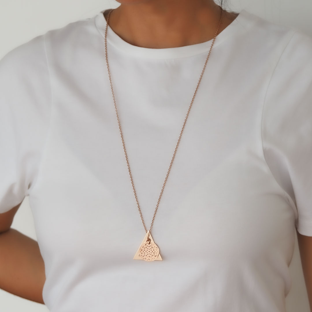 Model wearing Dandelion and Deltaglyph Rose Gold on long chain