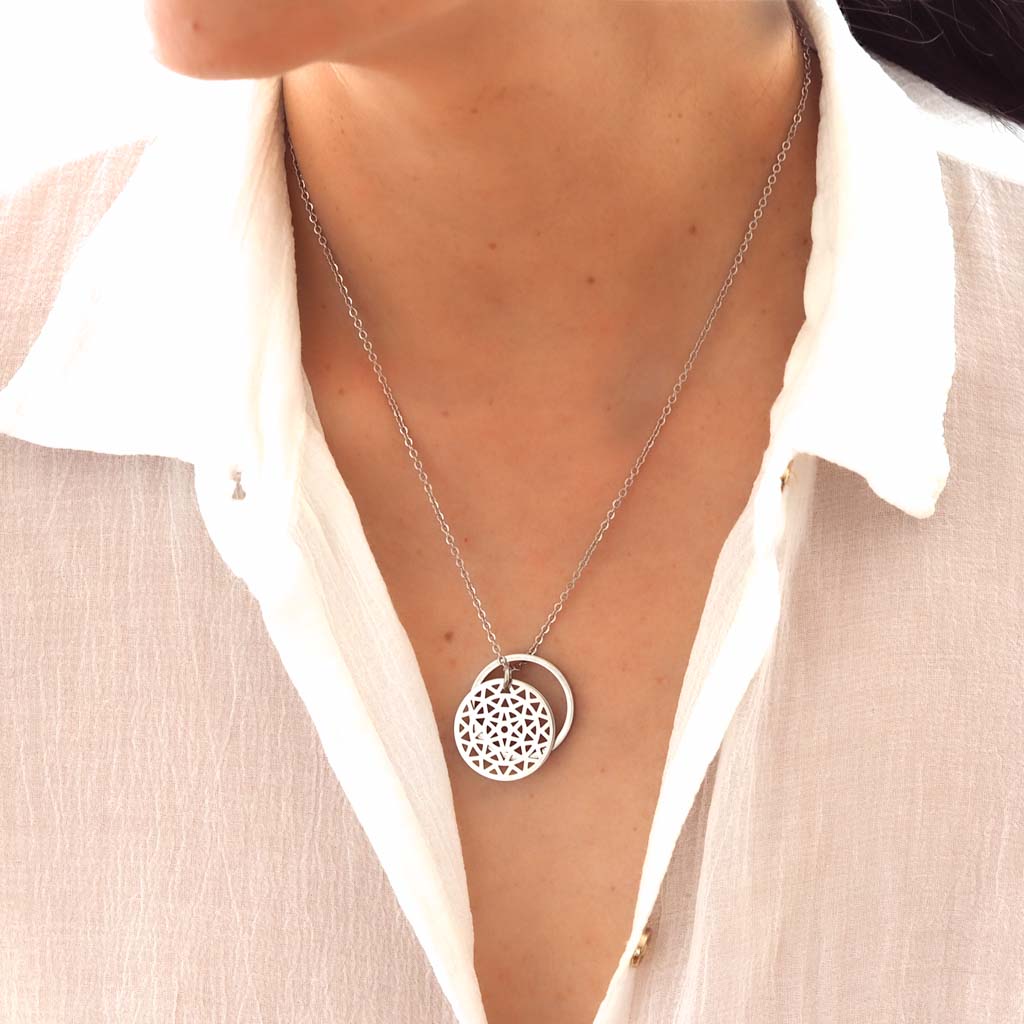 Model wearing Dandelion and Ring of Fire pendant Rhodium short chain