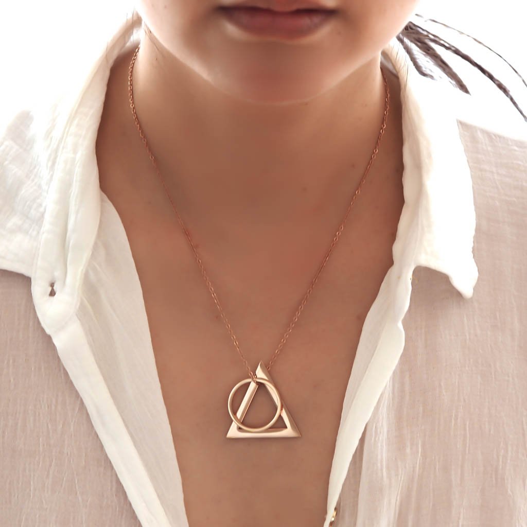 Model wearing Deltaglyph and Ring of Fire Rose Gold short chain
