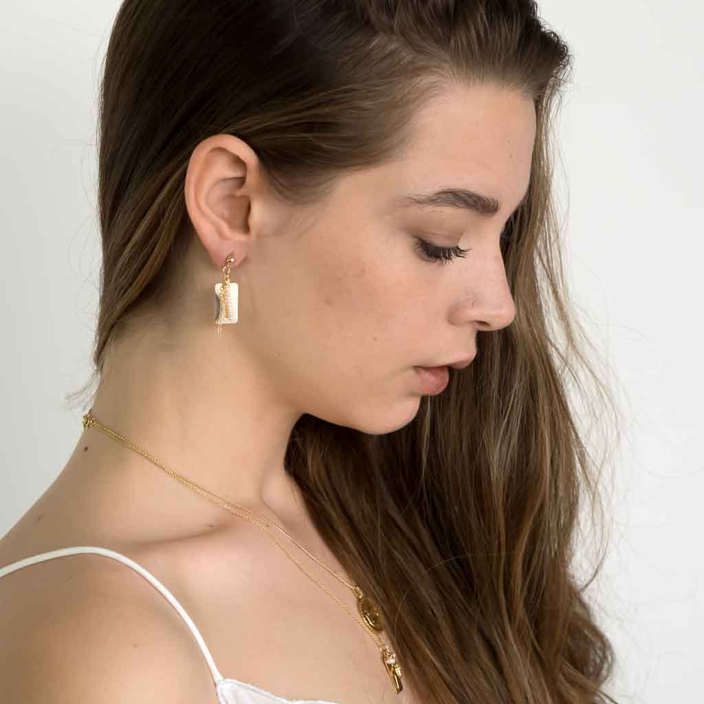 Model wearing Reflections Pearl Drop Earrings