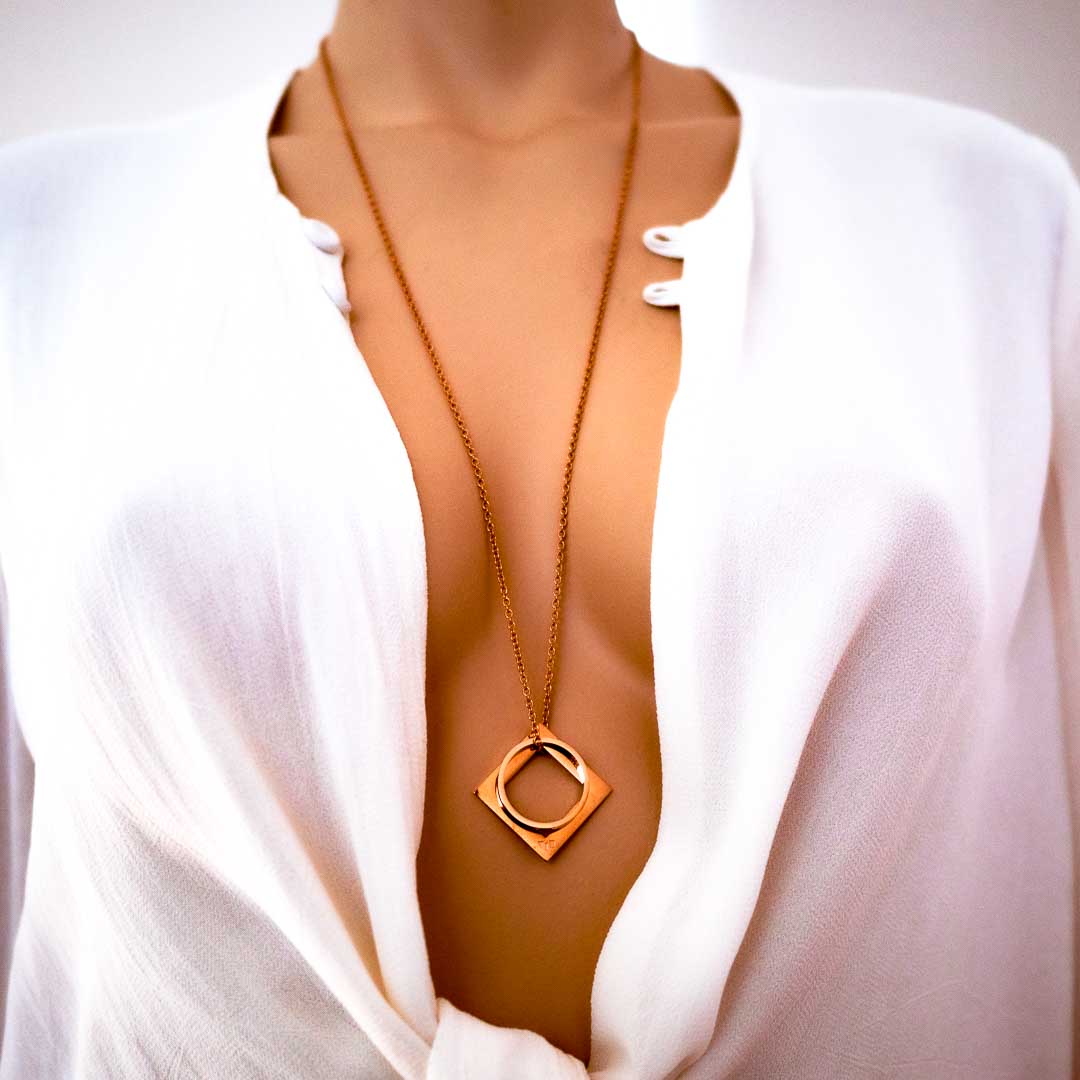 Model wearing diamond rof pendant Rose gold long chain