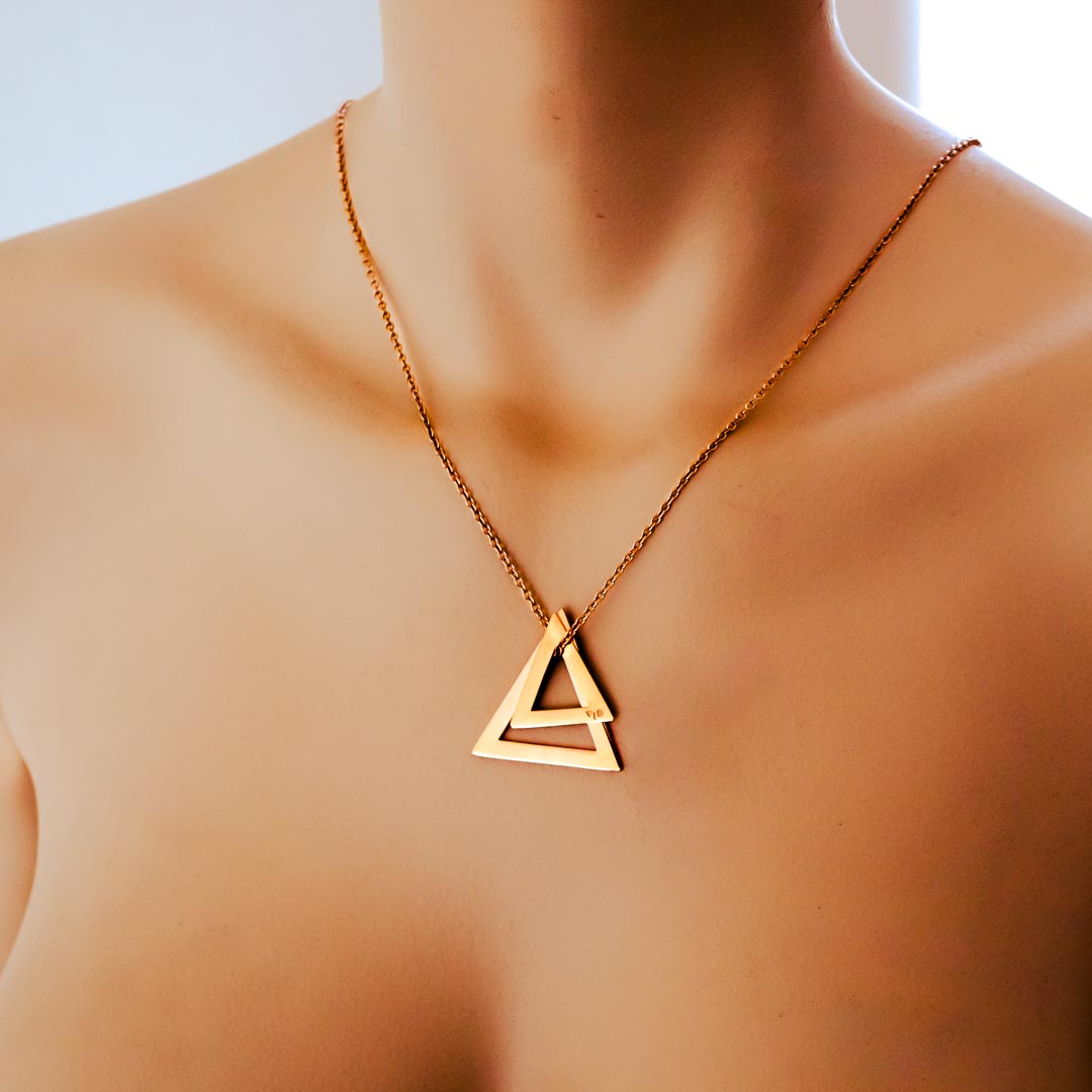Model wearing double deltaglyph rose gold short chain