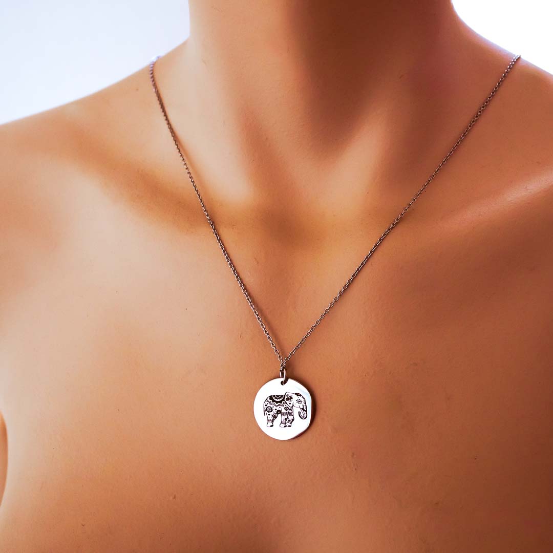 Model wearing single elephant pendant rhodium short chain