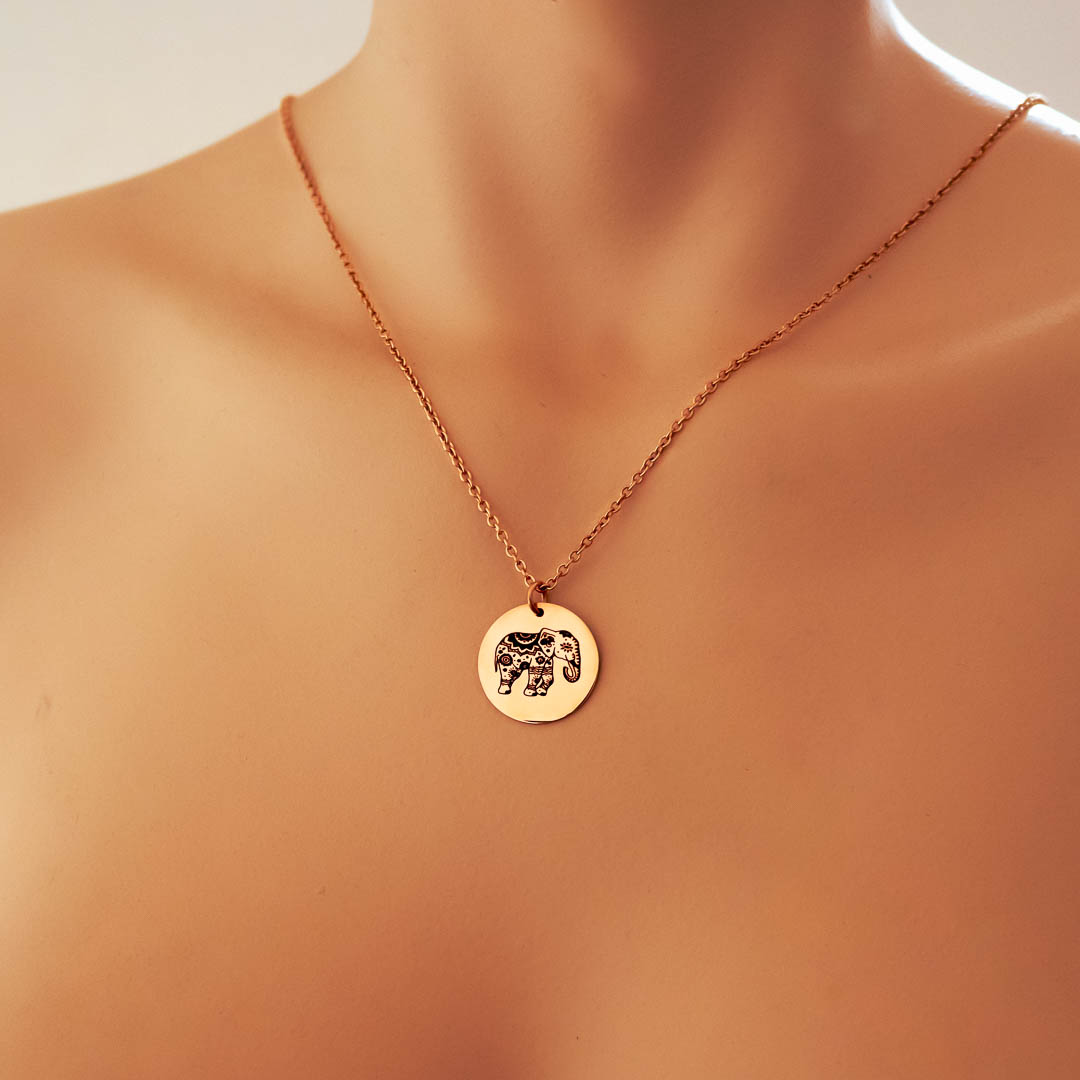 Model wearing single elephant pendant rose gold short chain
