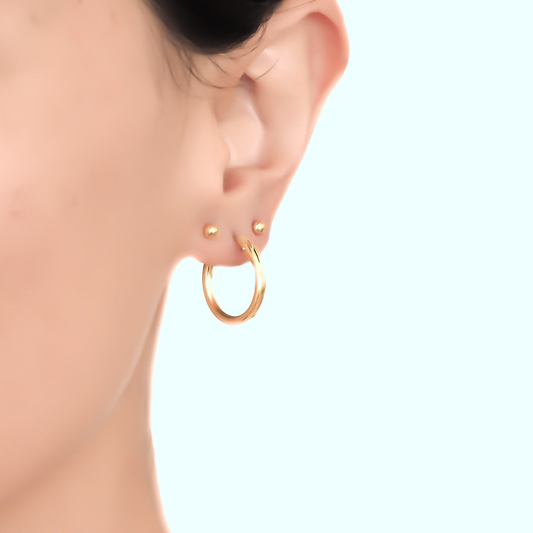 Model wearing perfect hoop earrings 19mm gold
