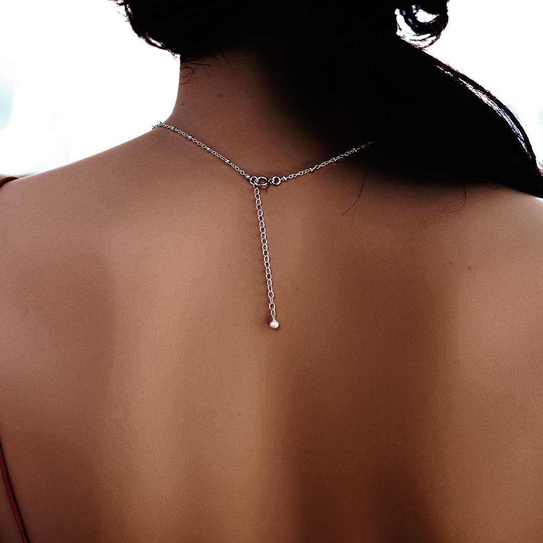 Model wearing Satellite cable chain silver back view