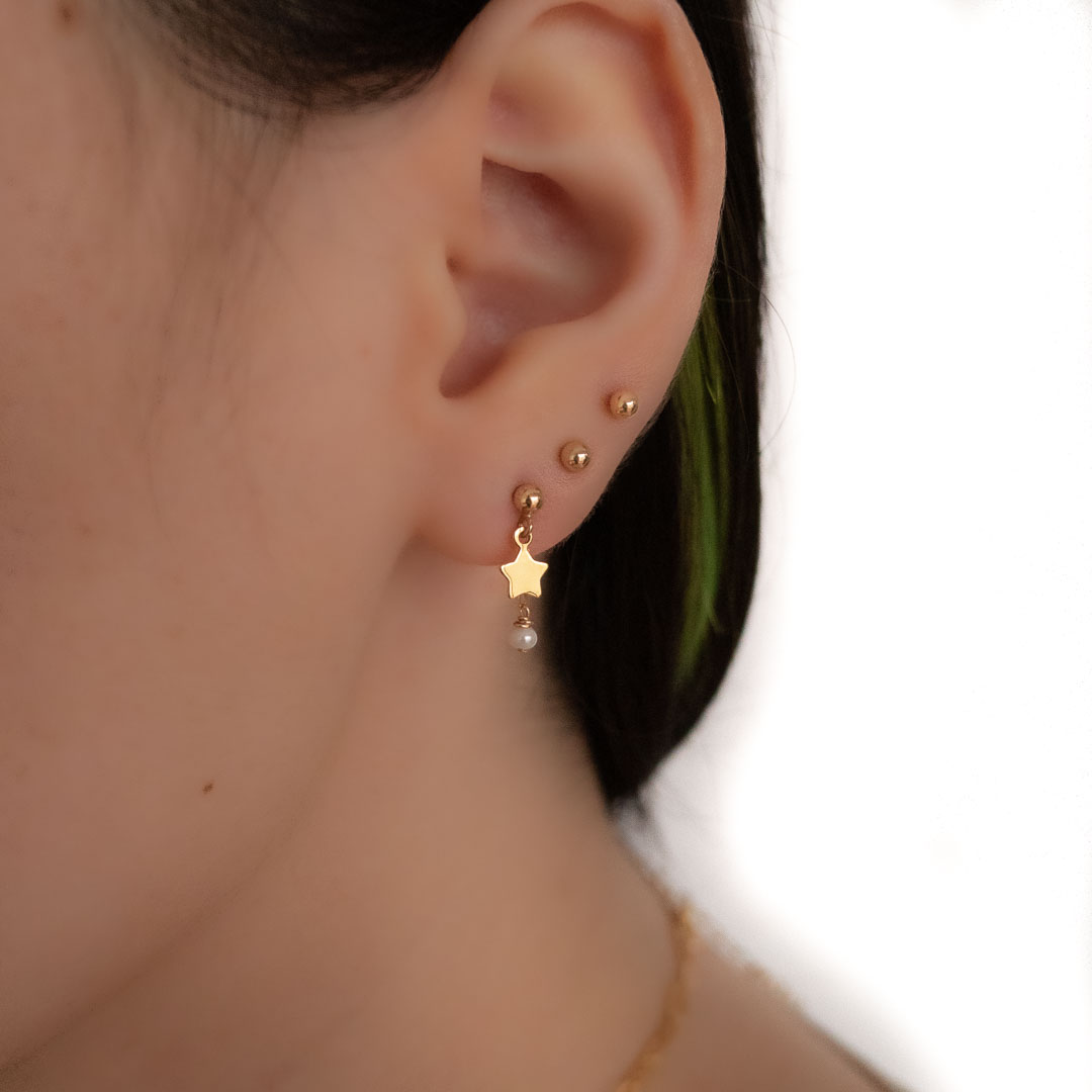 Model wearing Starburst earrings