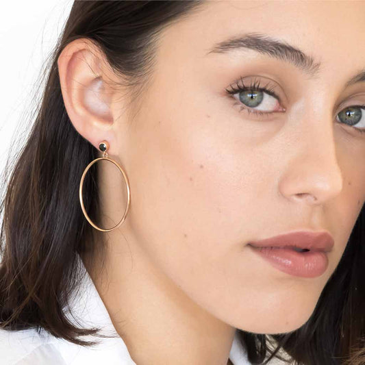 model wearing Circlette Hoop earrings rose gold black spinel