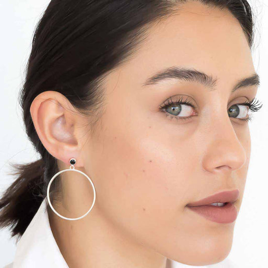 model wearing Circlette Hoop earrings sterling silver black spinel