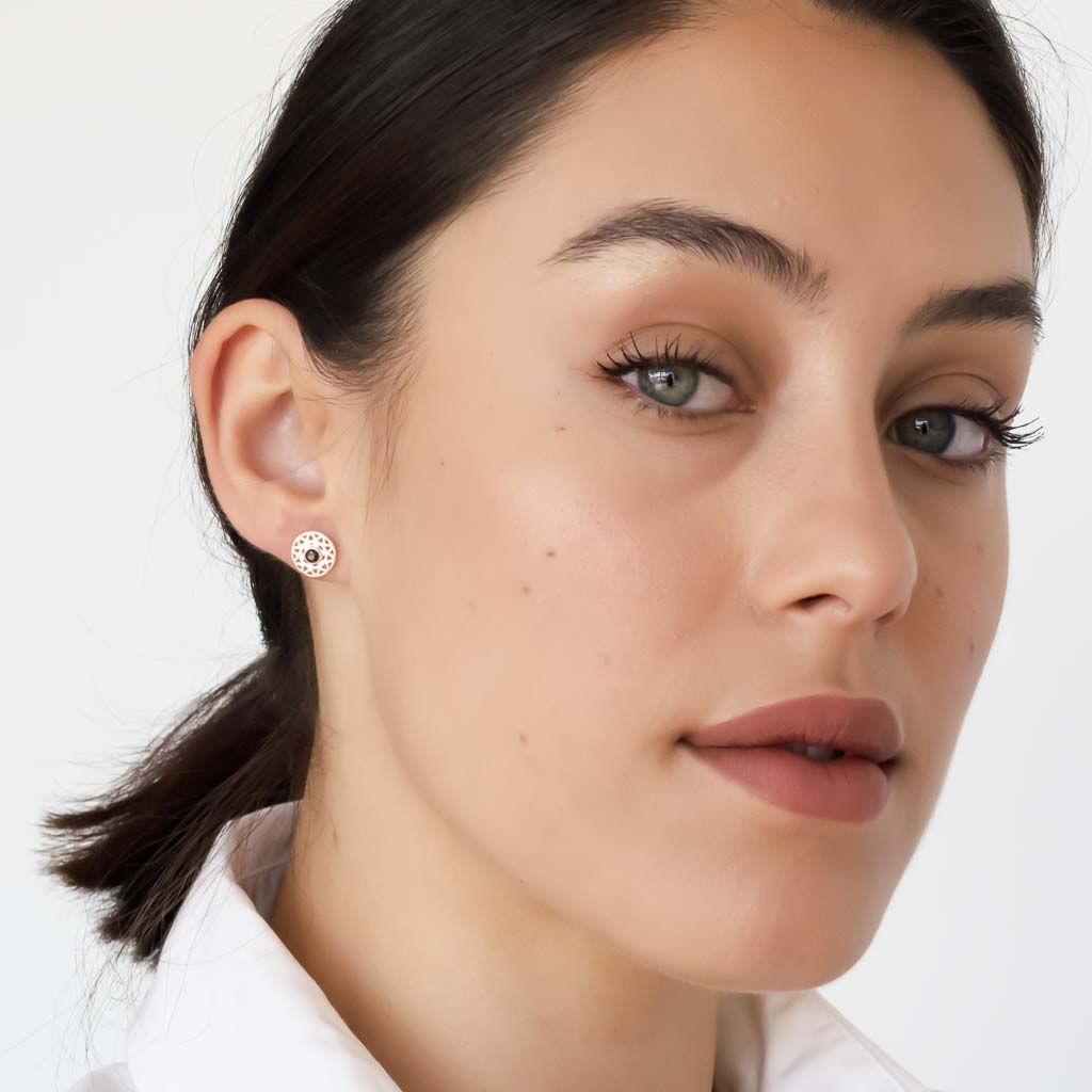 model wearing taraxacum earrings silver black spinel