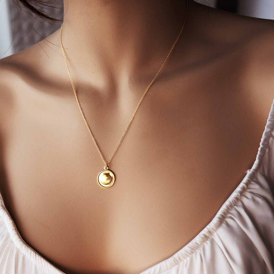 model wearing Seashore mini medalion necklace gold