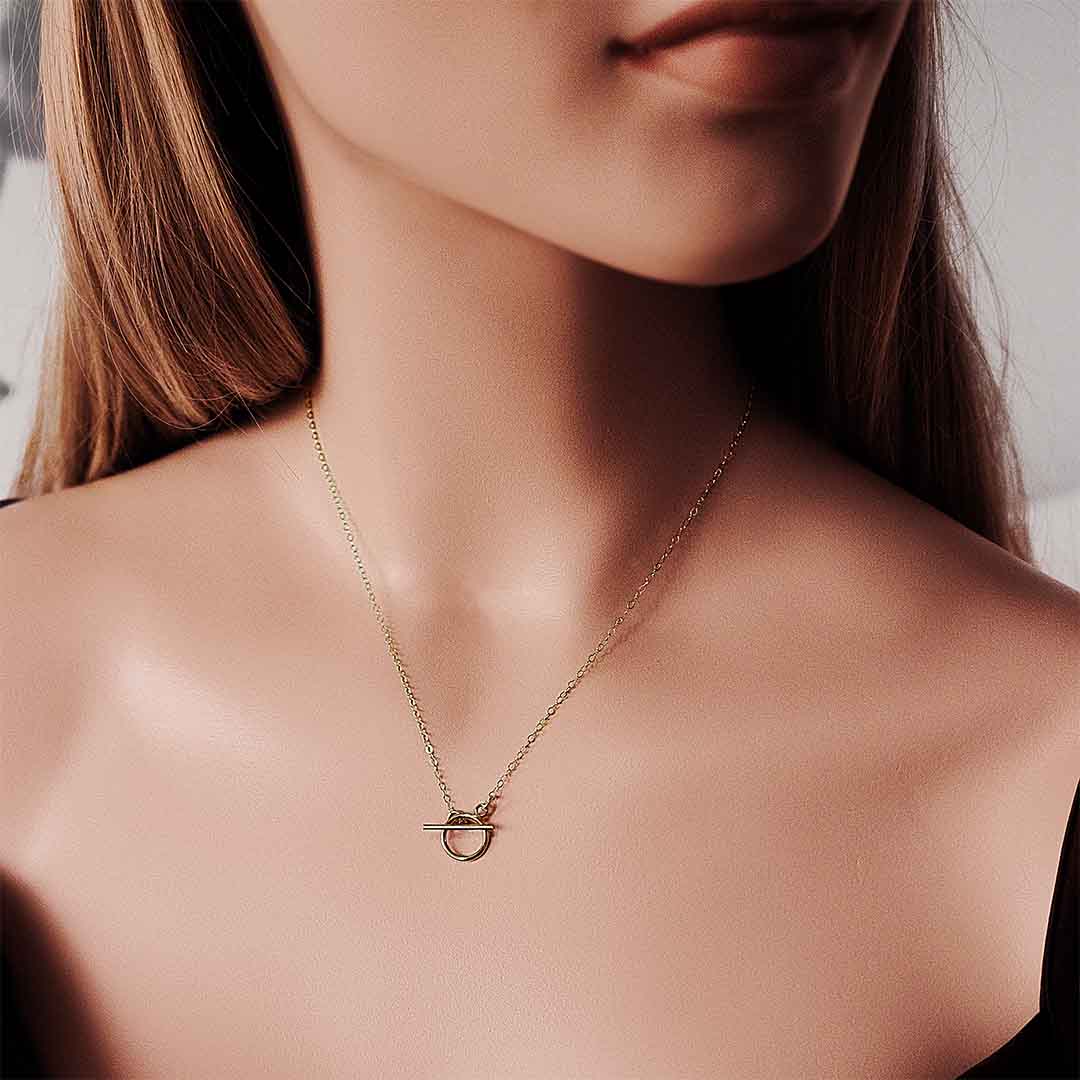model wearing Baby T Bar Necklace – Gold