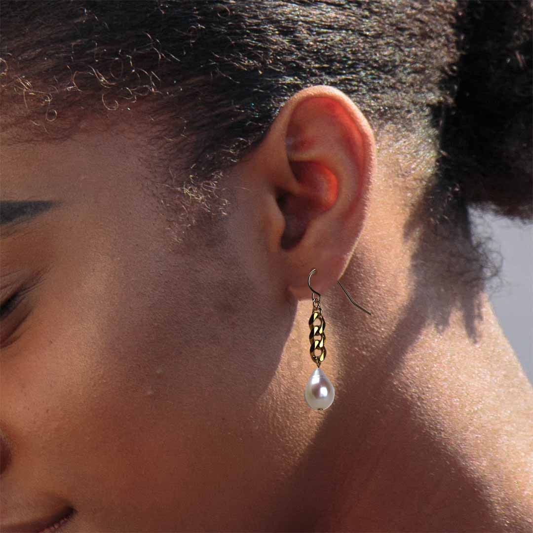 model wearing Cosmo Chain Pearl Drop Earrings - Gold and Pearl