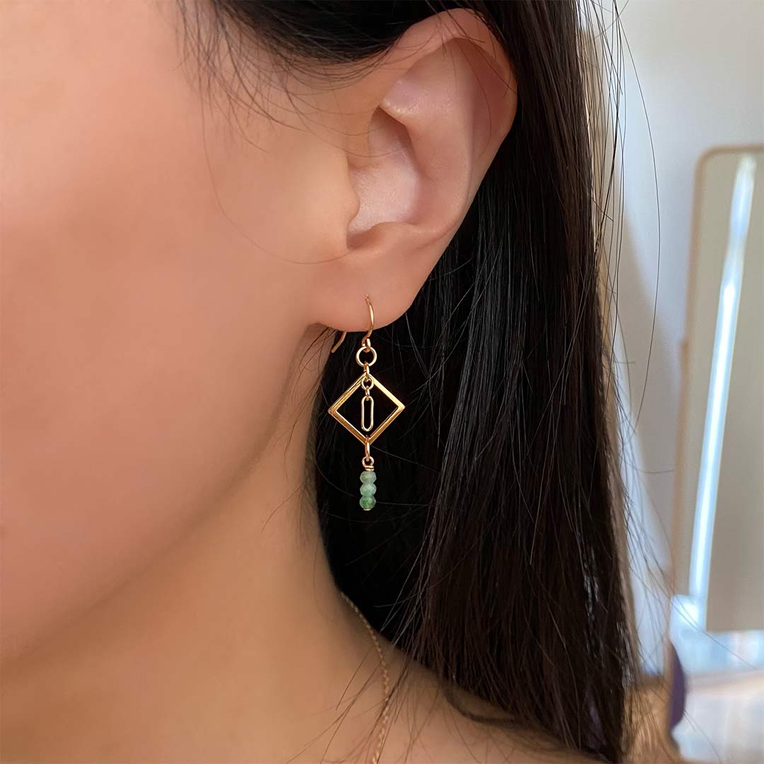 model wearing Minty Diamond Drop Earrings - Gold and Emerald