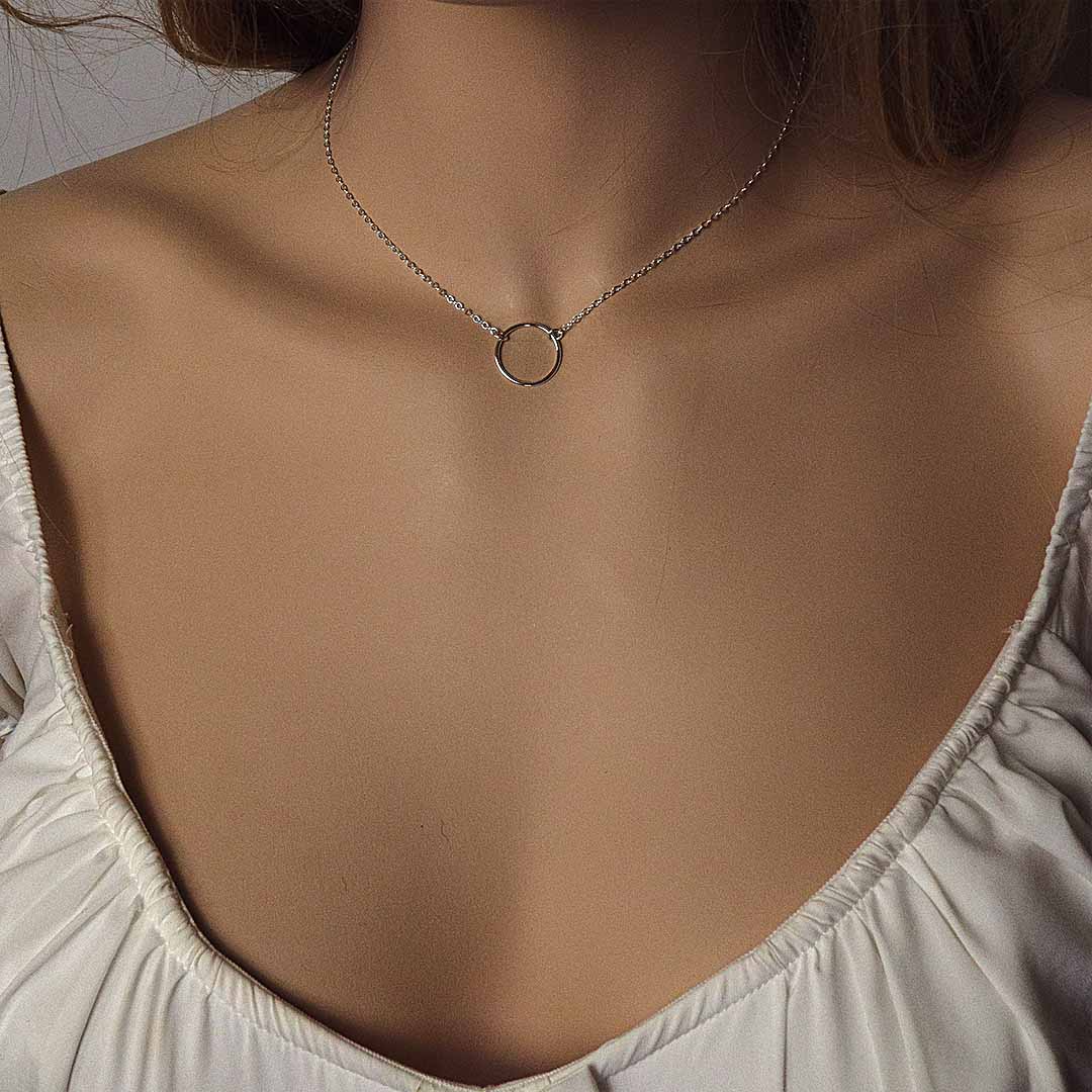 model wearing ring necklace silver short chain