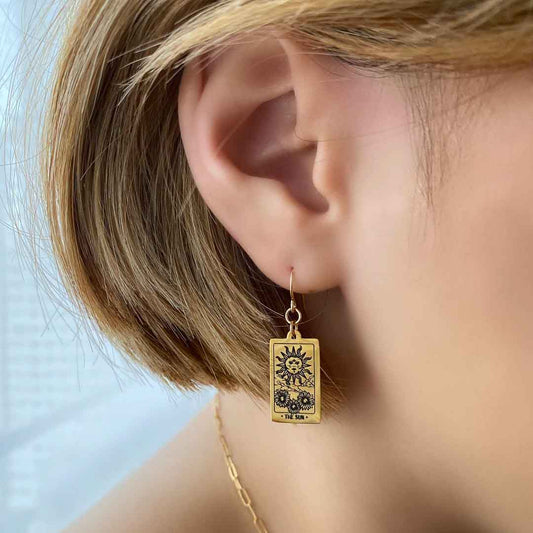 model wearing Sun Tarot Earrings 14K gold filled jewellery closeup