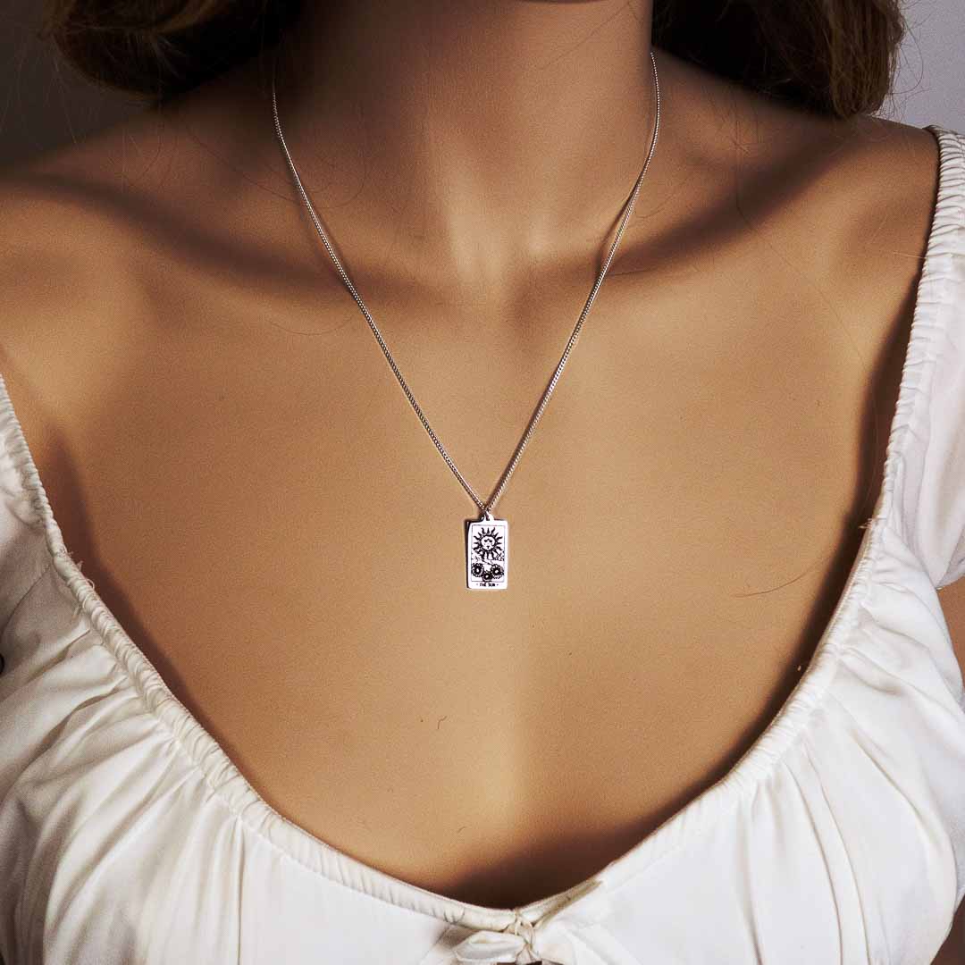 model wearing Tarot Sun necklace pendant sterling silver jewellery