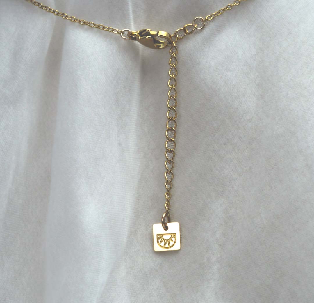 Eden Necklace - Gold and Carnelian back logo tag