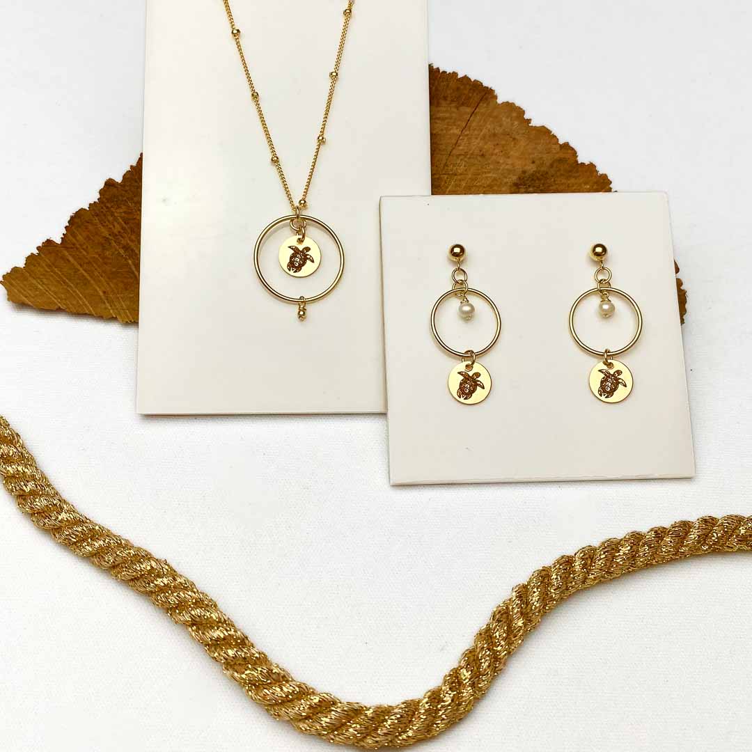 sea turtle earrings necklace gold flatlay